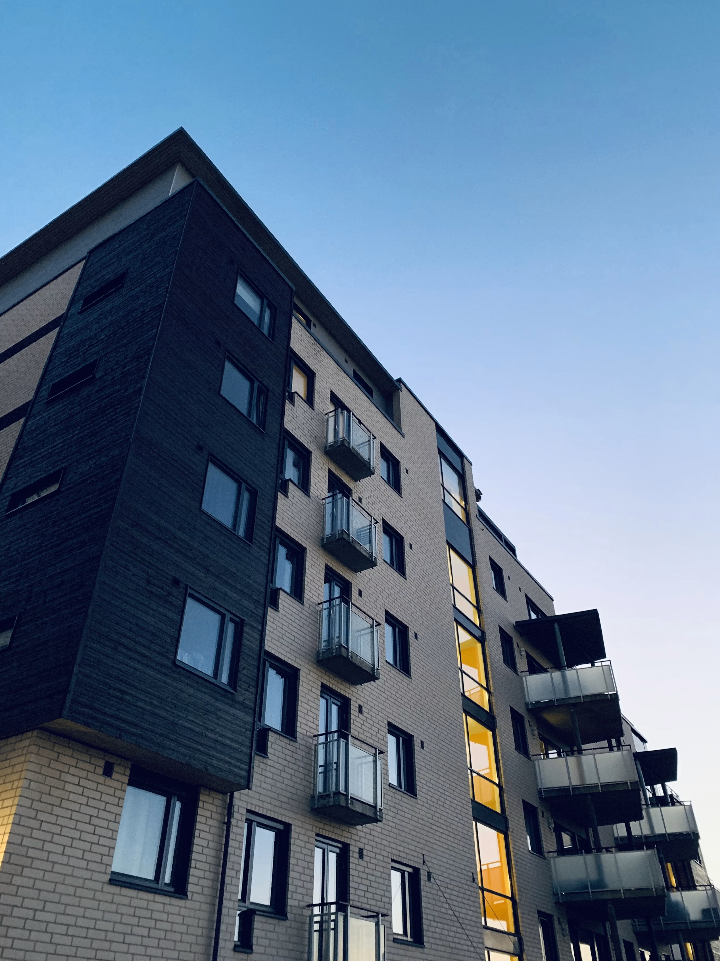 Modern apartment building at dusk